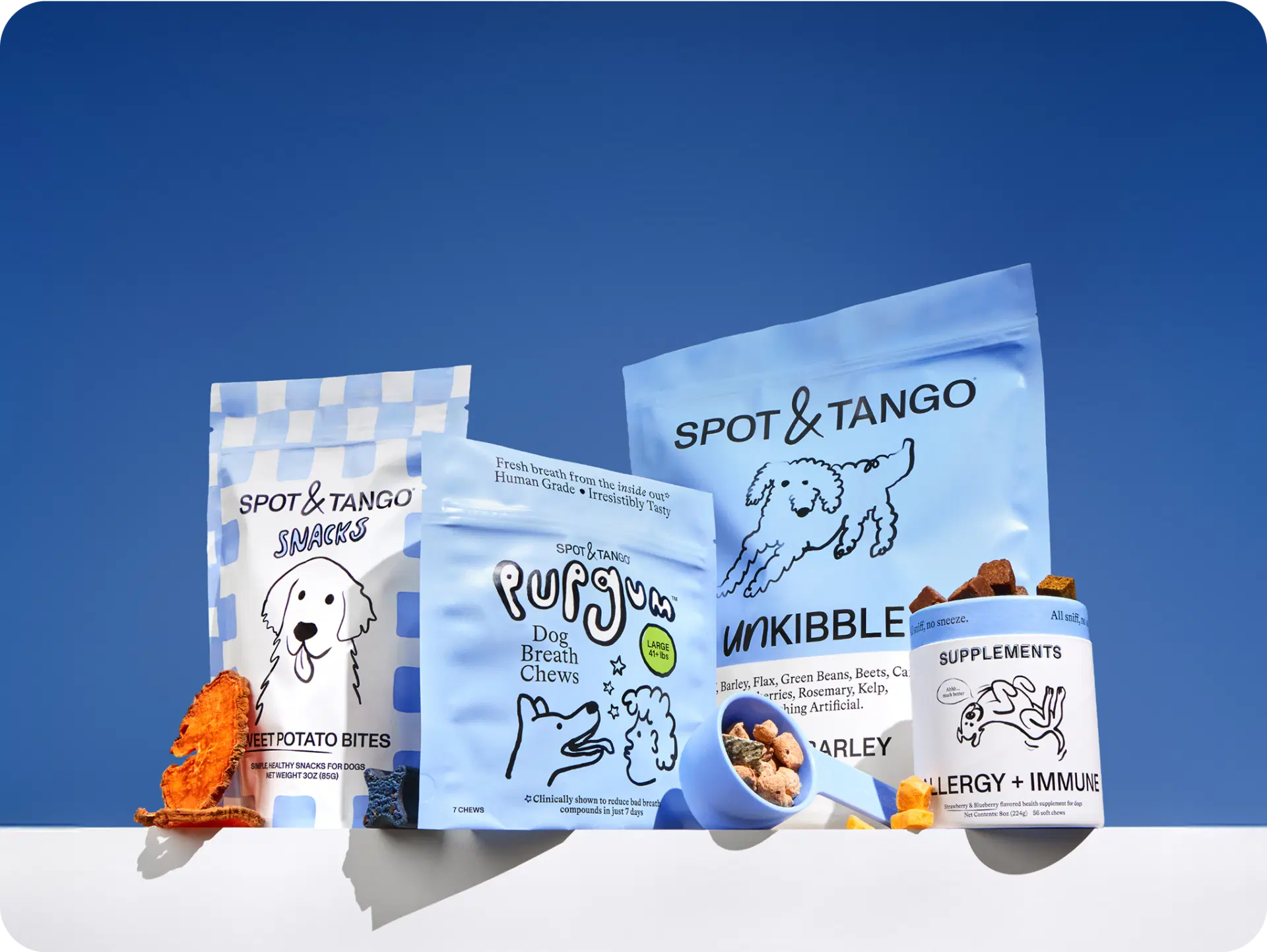 Line up of Spot & Tango snacks, PupGum, UnKibble, and supplements